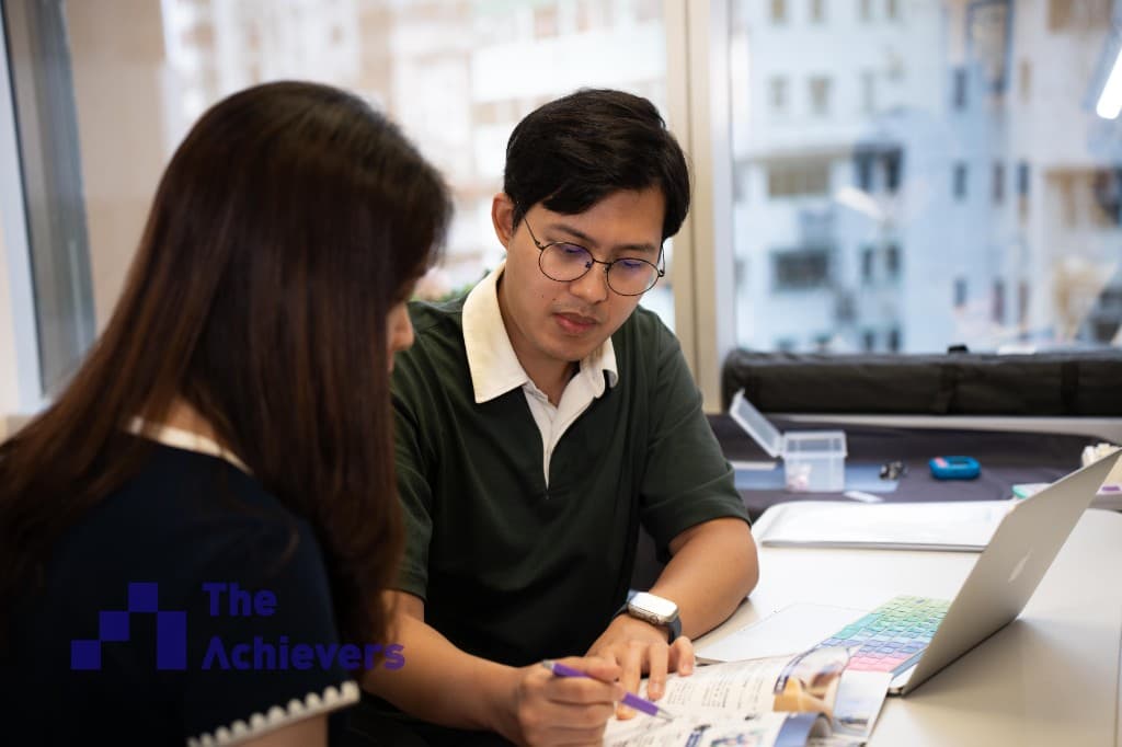 An Achievers tutor reviewing study materials with a student